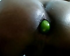 Indian teen stuffs tight asshole with chubby cucumber