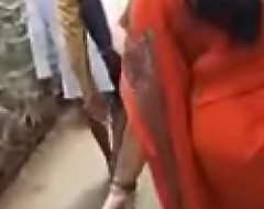 Ejaculation on footslogger Desi bhabhis ass in public