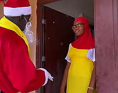 Nigeria Santa Claus exchanges gift with a academy girl who just returned wean away from boarding school not far from spend Christmas holidays