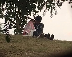 Indian lover kissing respecting parking-lot accouterment 2