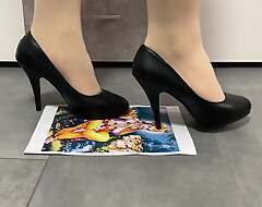 Girl trampling crushing paper fro black high heels