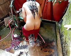 Beautiful Desi village girl bathing far get under one's open.